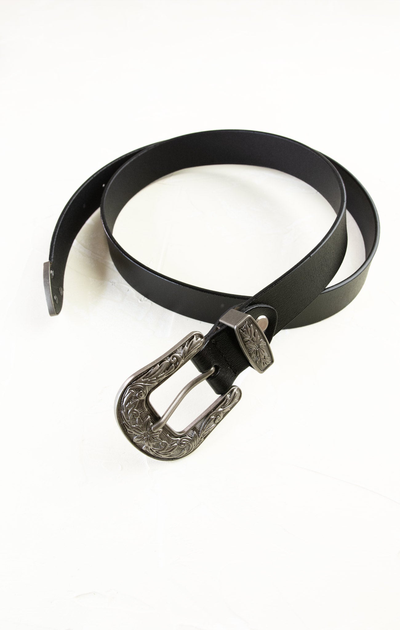 Black belt with a silver buckle on a white background