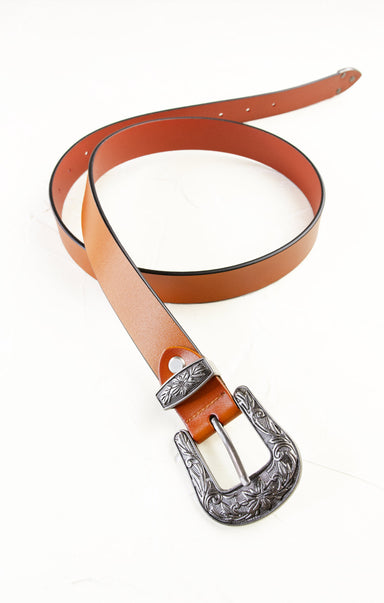 Brown leather belt with an ornate silver buckle on a white background