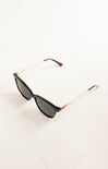 Sunglasses with gold and red frame on a white background