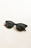 Black sunglasses with red accents on a white background