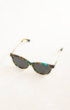 Sunglasses with tortoiseshell frame and dark lenses on a white background
