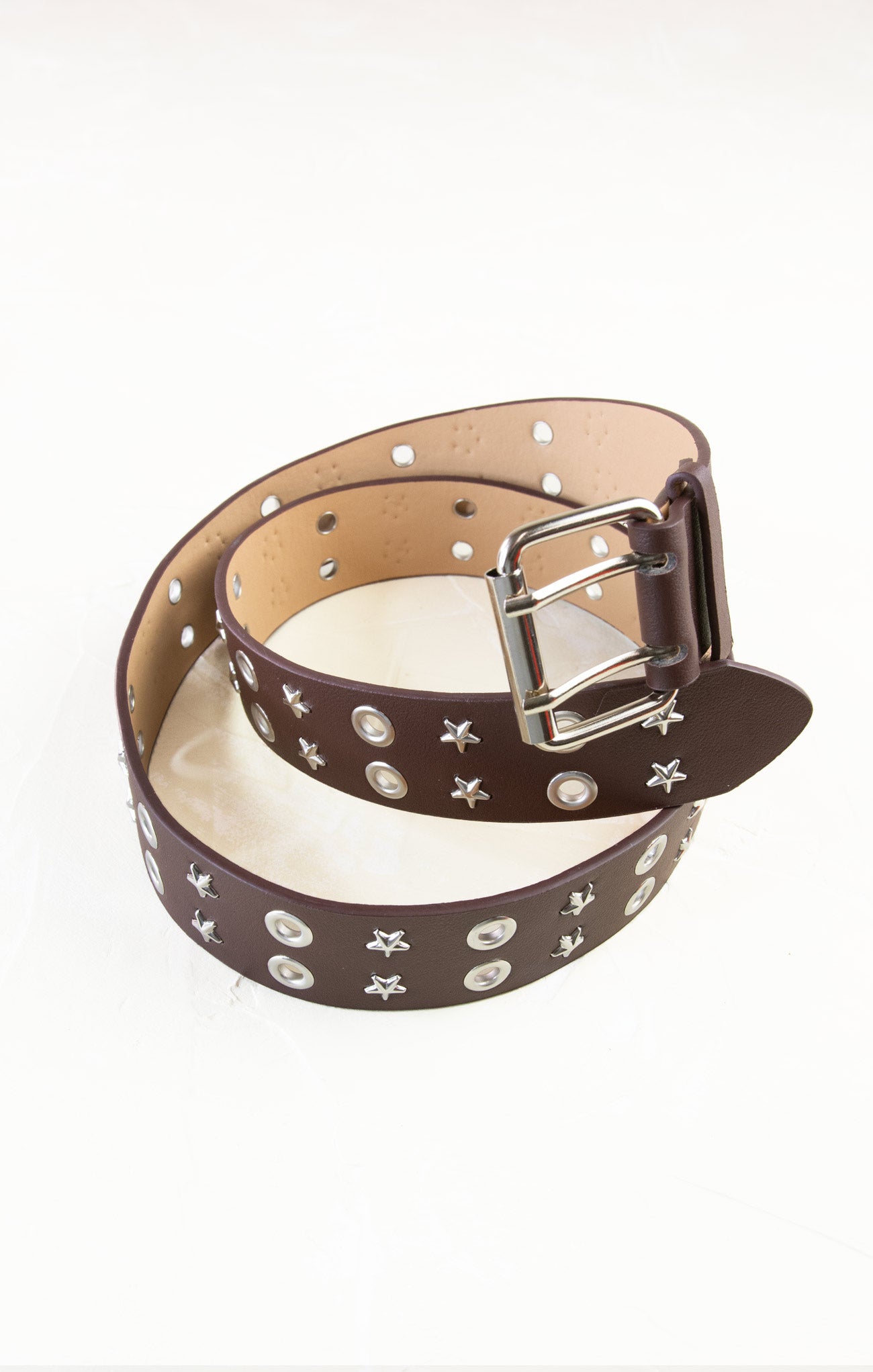 Brown belt with star patterns on a white background