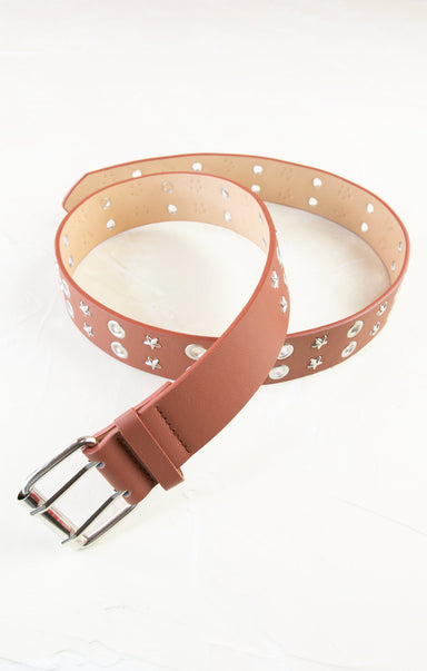 Pink belt with white heart patterns on a white background