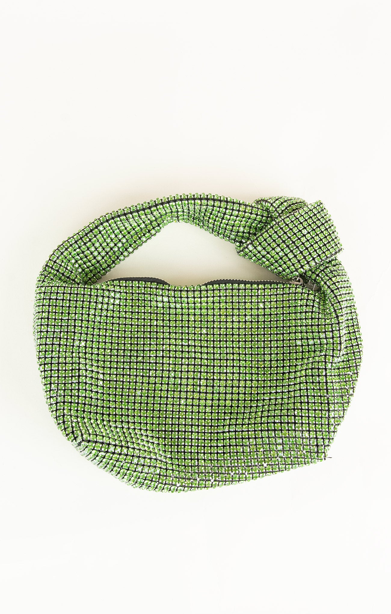 Green woven bag on a white background