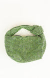 Green woven bag on a white background
