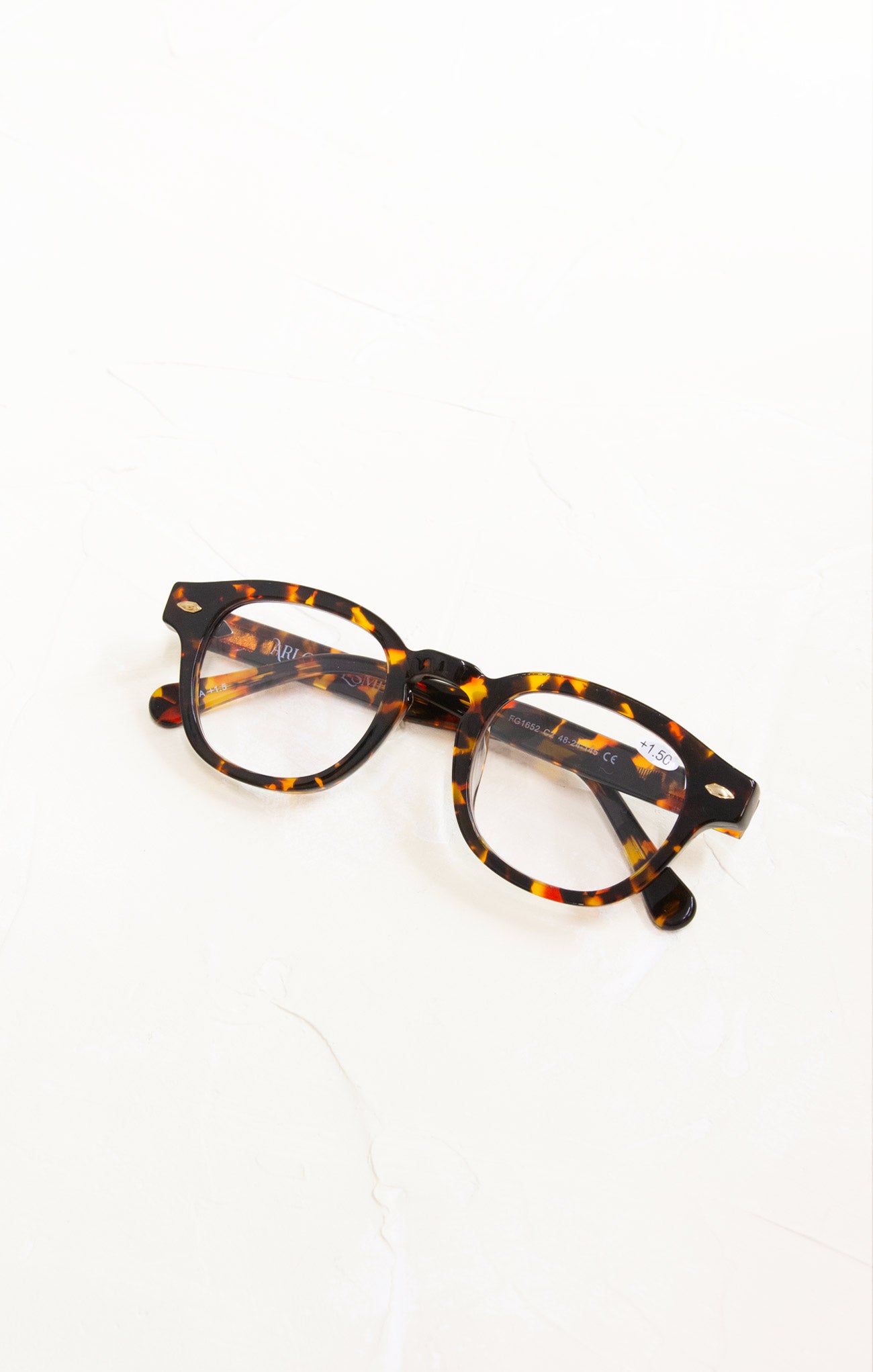 Tortoiseshell eyeglasses on a white background