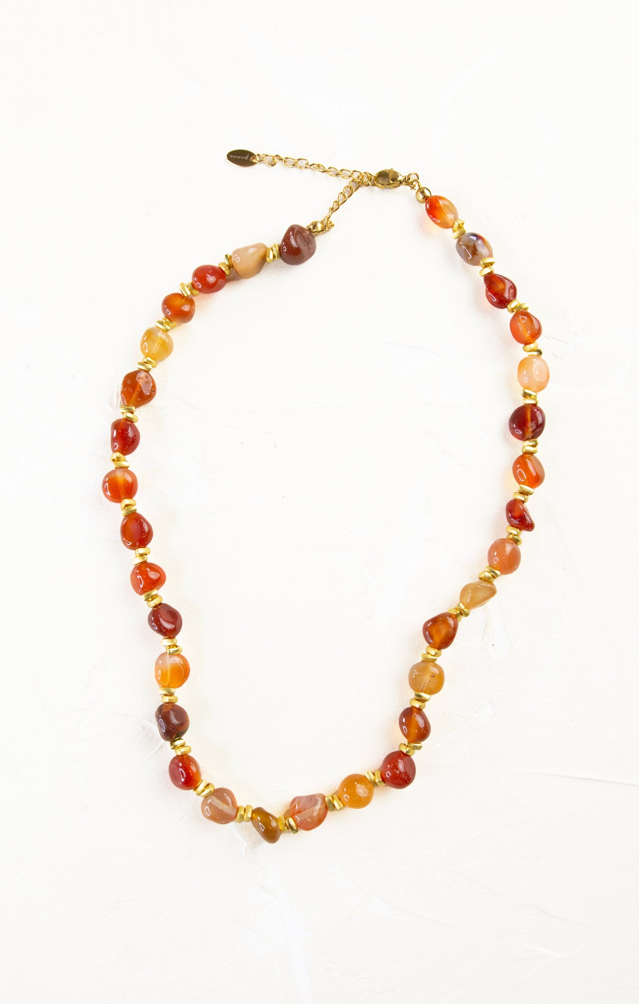 Necklace with multicolored beads on a white background