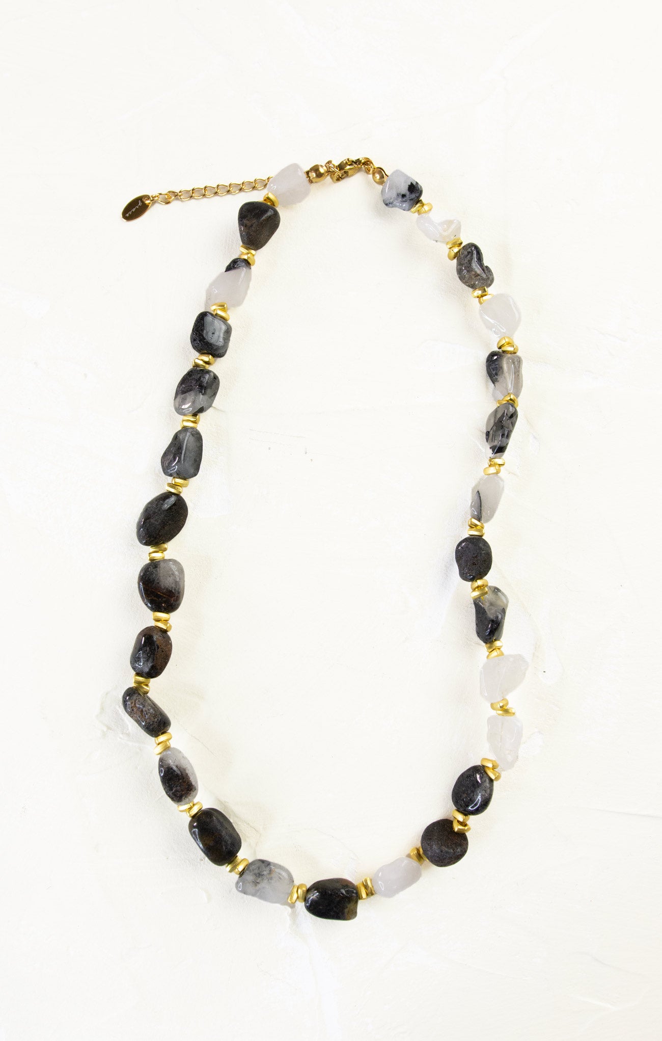 Necklace with black and white beads on a white background
