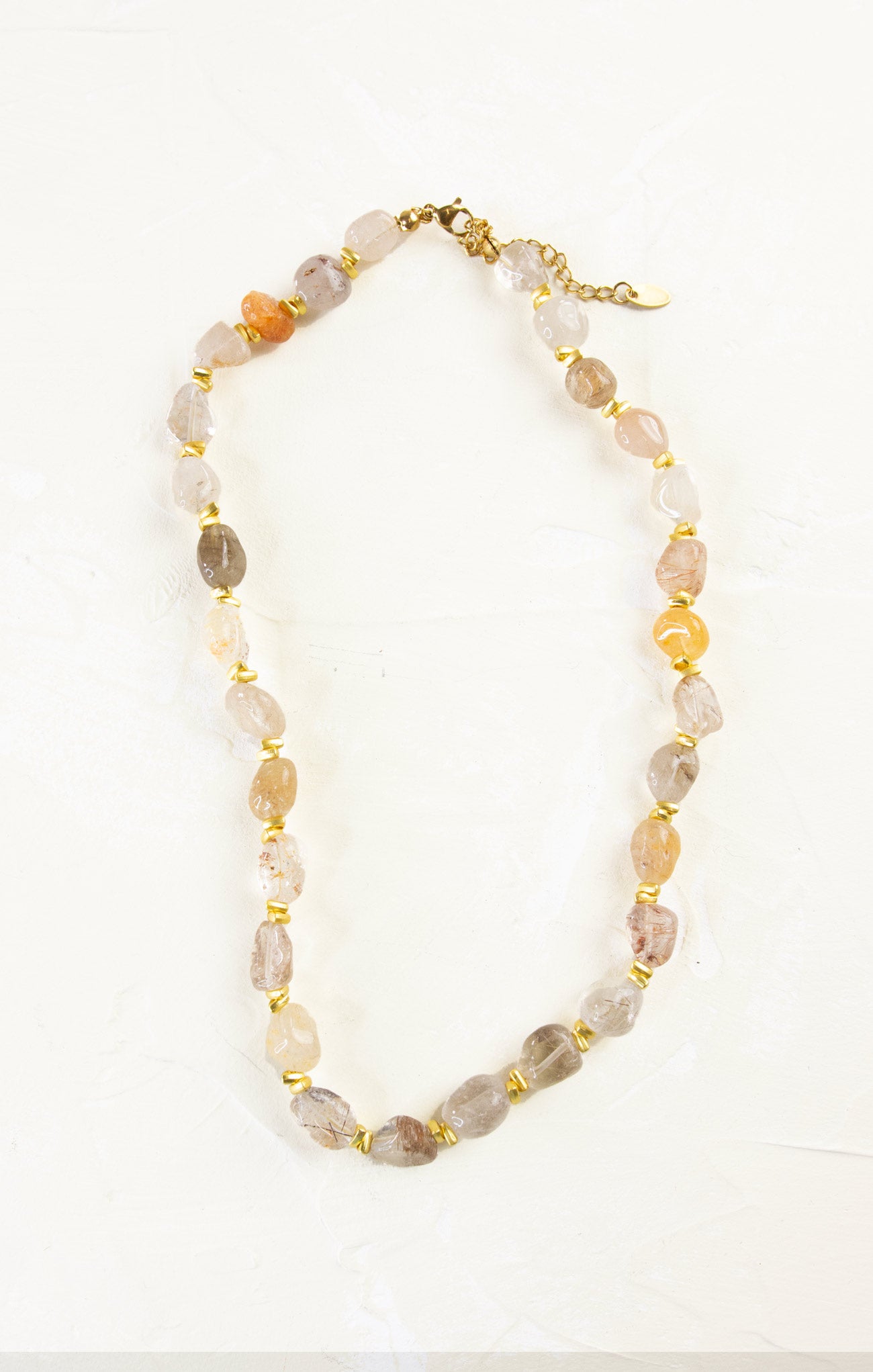 Necklace with multicolored beads on a white background