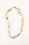 Necklace with multicolored beads on a white background