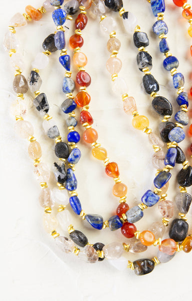 Multicolored beaded necklaces on a white background