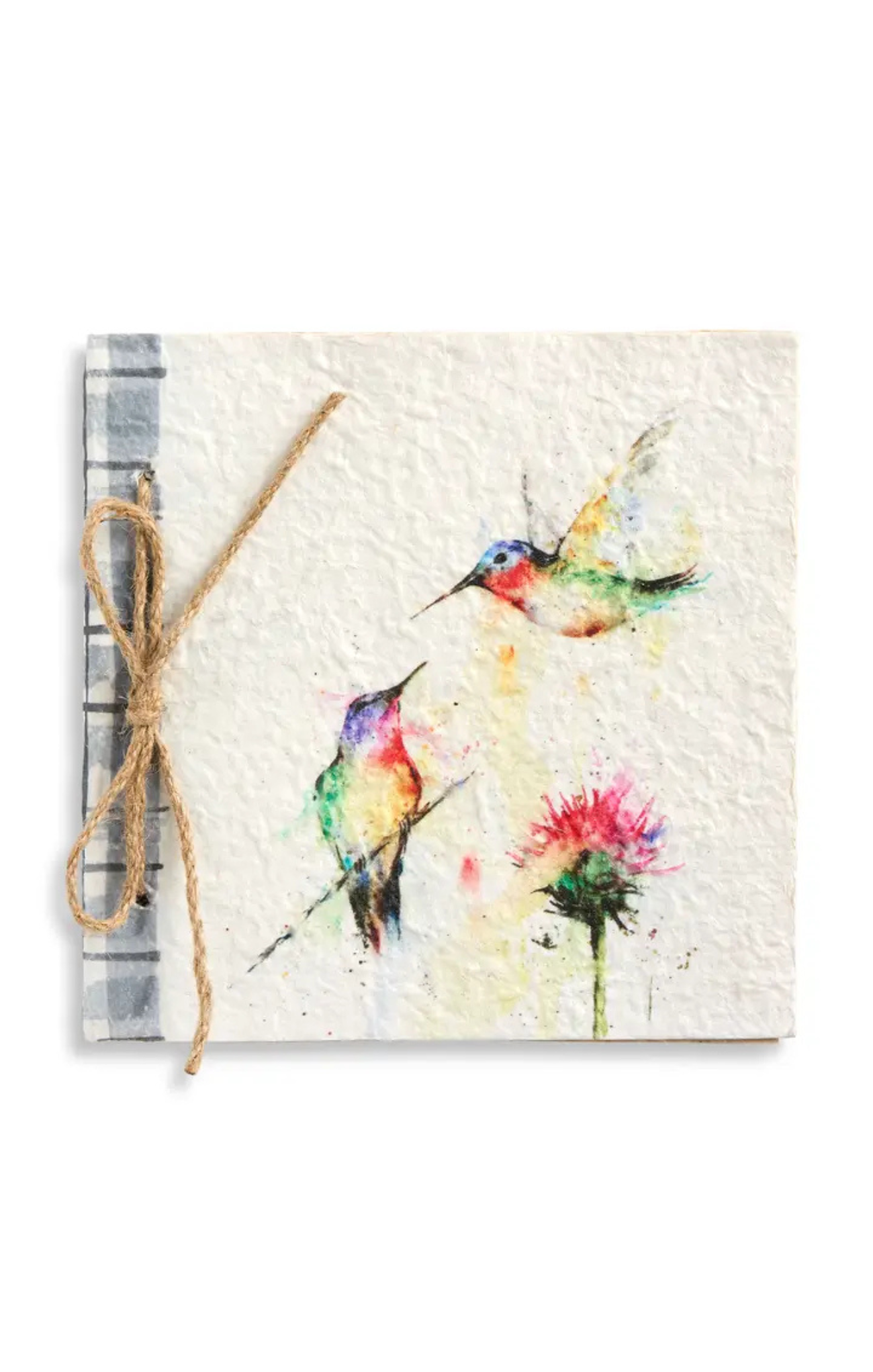 Notebook with watercolor design of hummingbirds and flowers, tied with twine on a white background