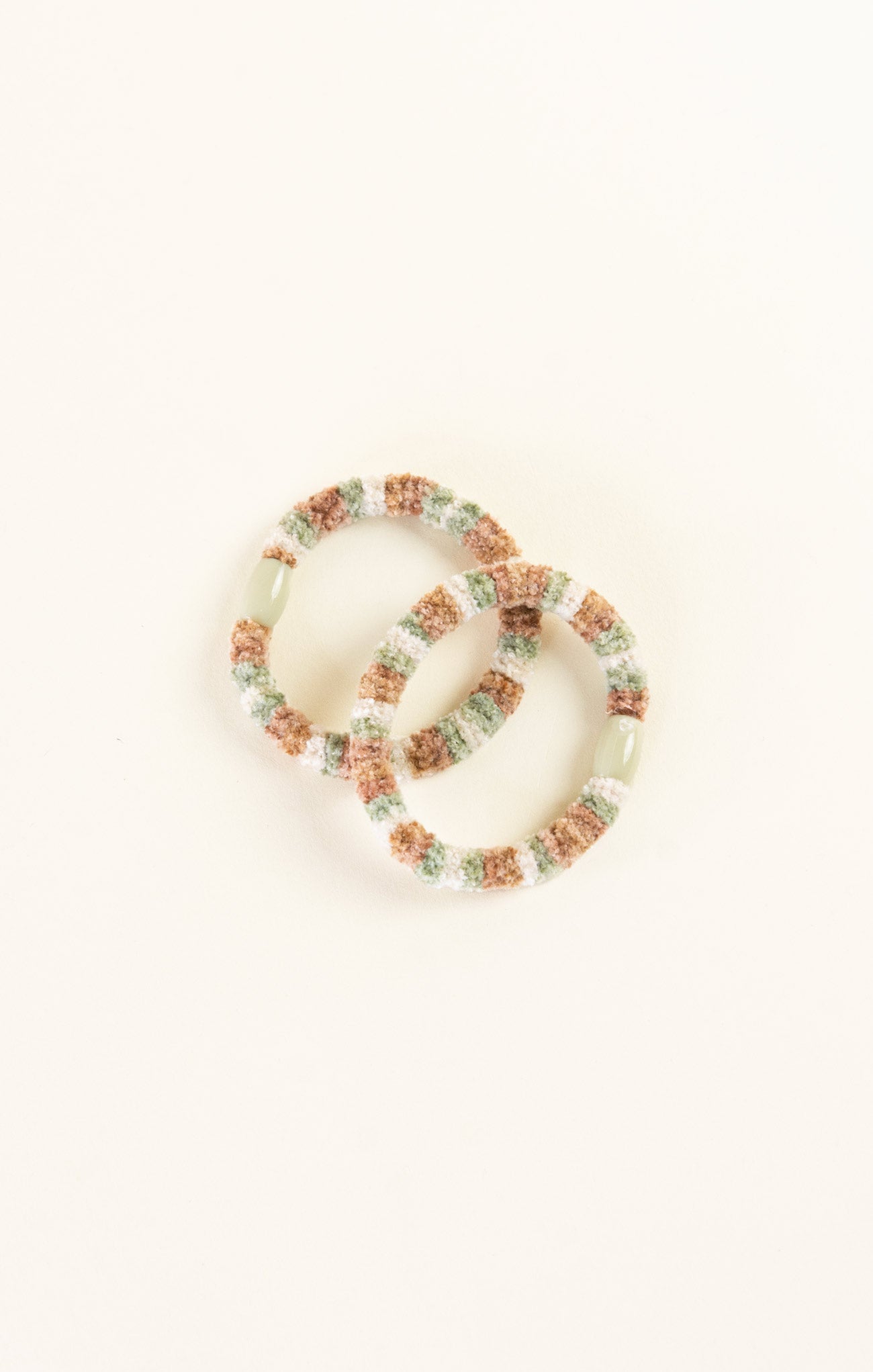 Set of colorful beaded bracelets on a white background