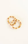 Two beaded bracelets on a white background