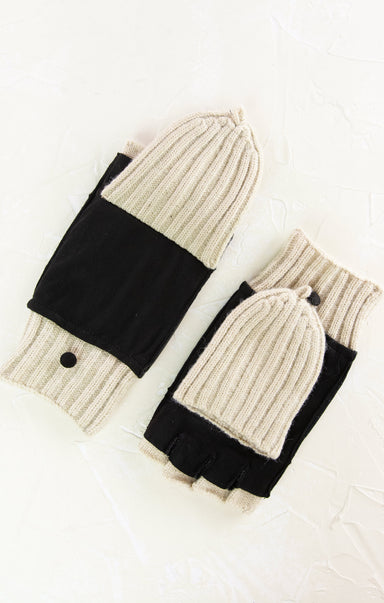 Knitted hat and gloves set with black accents on a white background