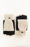 Pair of black and cream knit fingerless gloves on a white background