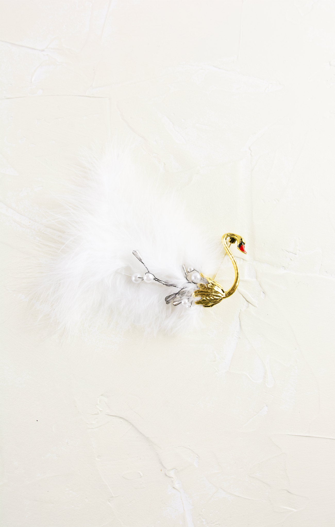Decorative swan ornament on a white background