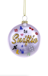 Decorative ornament with 'it's Swiftie' text and colorful designs on a white background