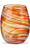 A stemless wine glass made of swirled orange, red, and white glass, shown on a clean white background.