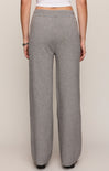 Gray sweatpants worn by a person on a plain background