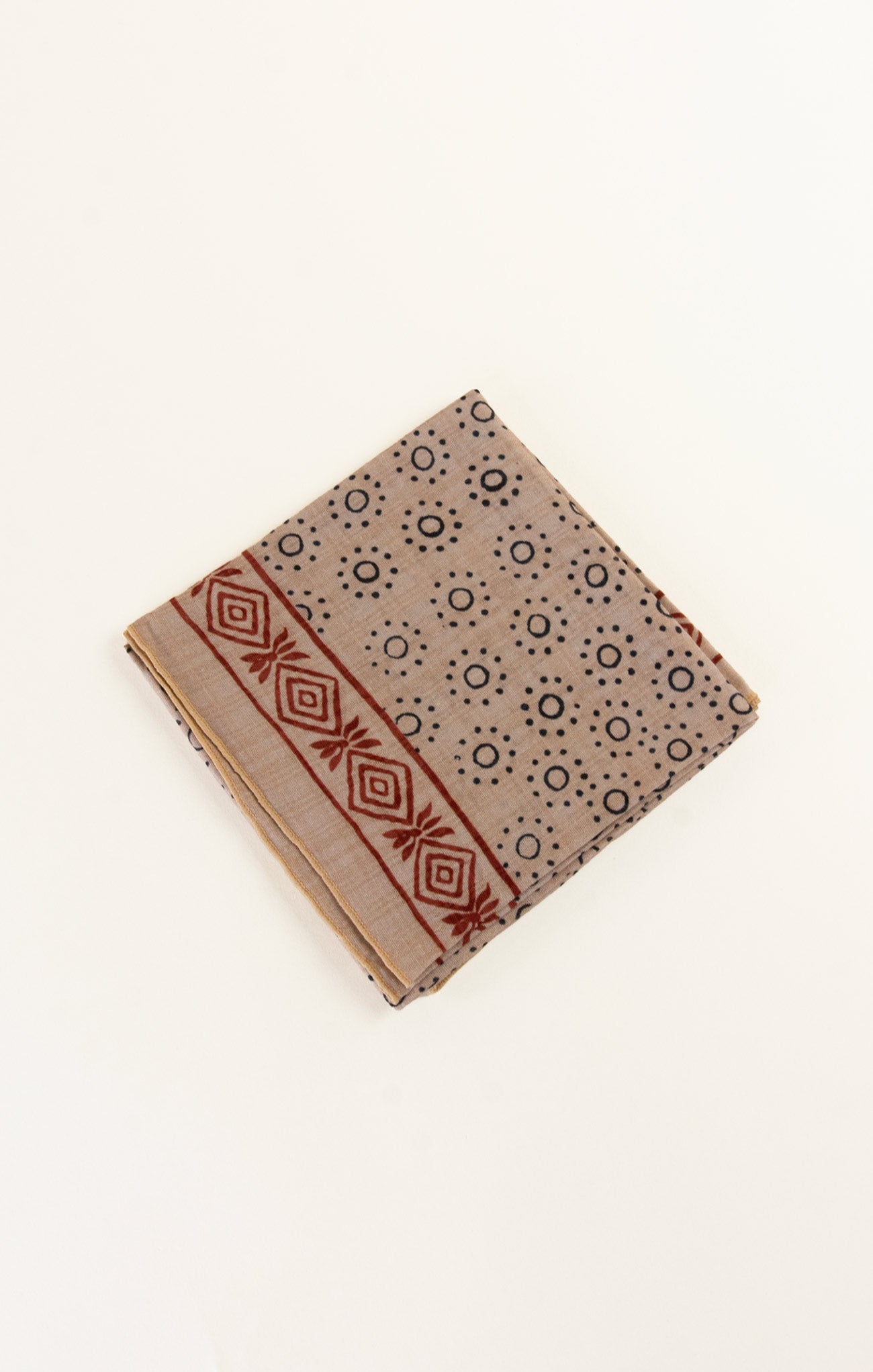 Beige fabric with geometric pattern on a white background