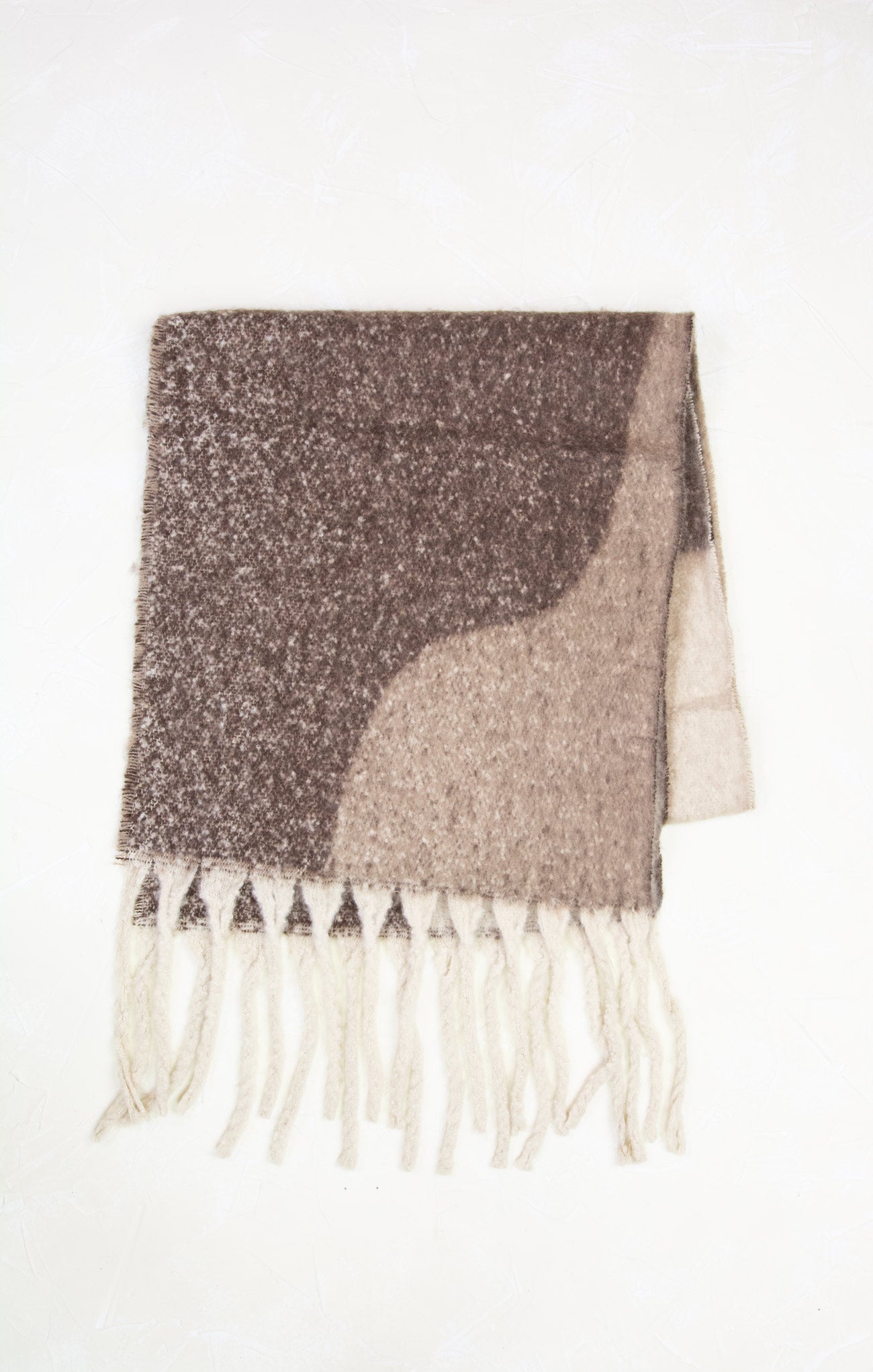 Textured scarf with fringe on a white background