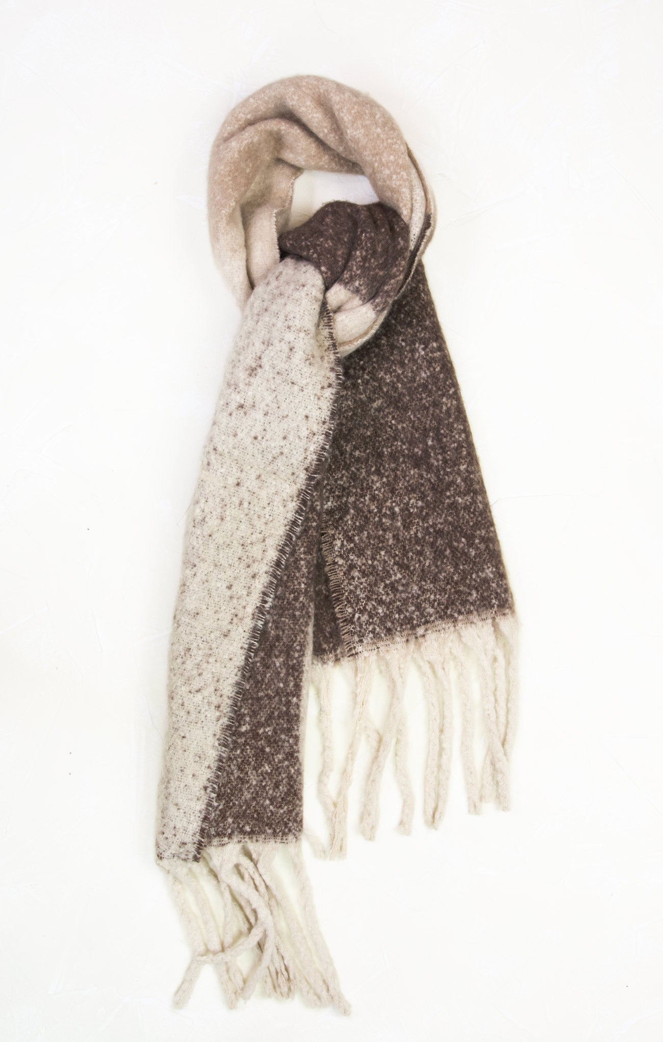 Two patterned scarves draped over a white background