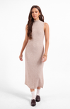 Woman wearing a beige sleeveless dress on a white background