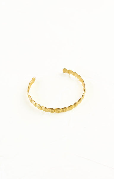 Gold bracelet on a white background