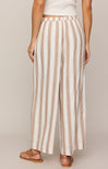 Striped pants worn by a person on a plain background