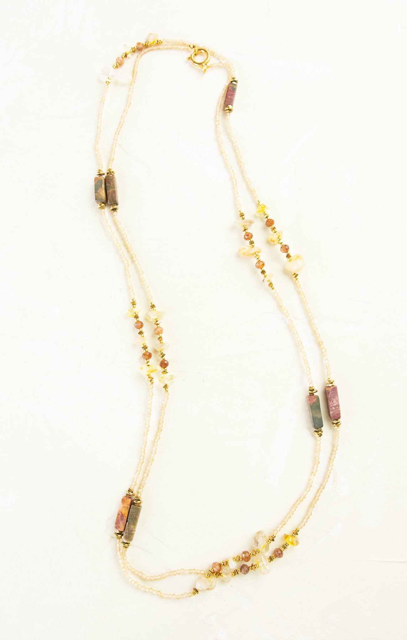 Necklace with multicolored beads on a white background