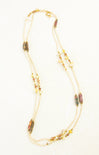 Necklace with multicolored beads on a white background