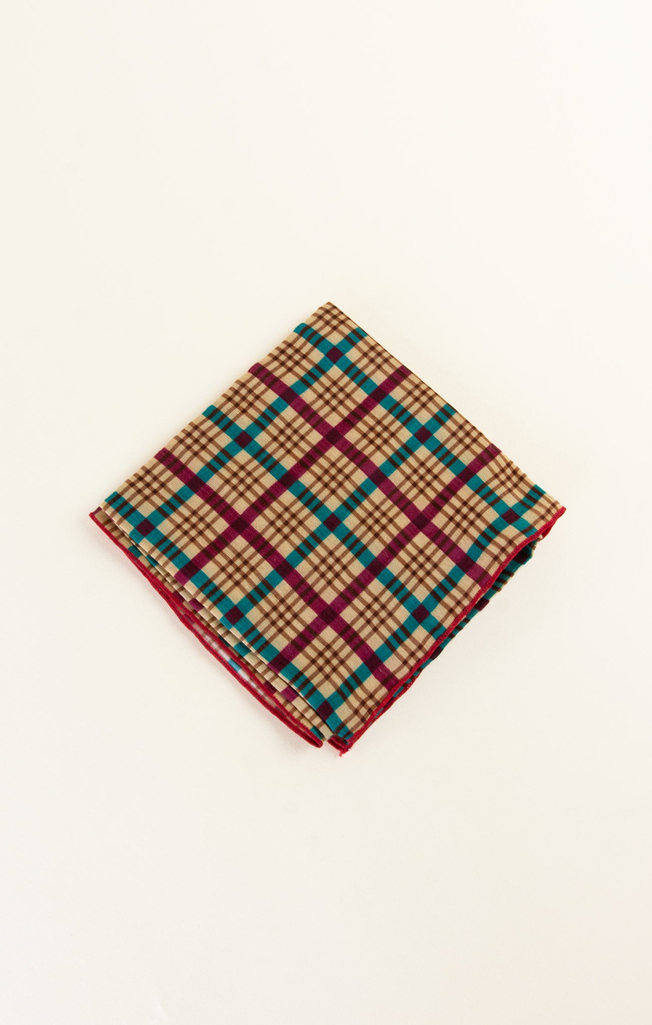 Folded plaid fabric on a white background