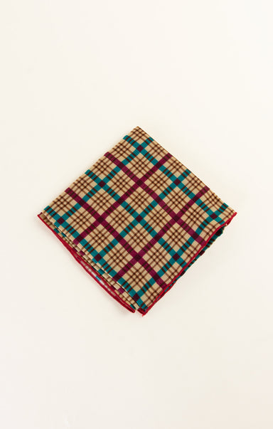 Folded plaid fabric on a white background