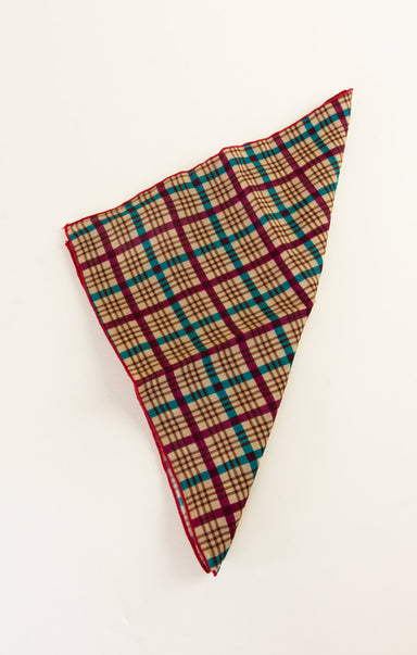 Plaid patterned pocket square on a white background