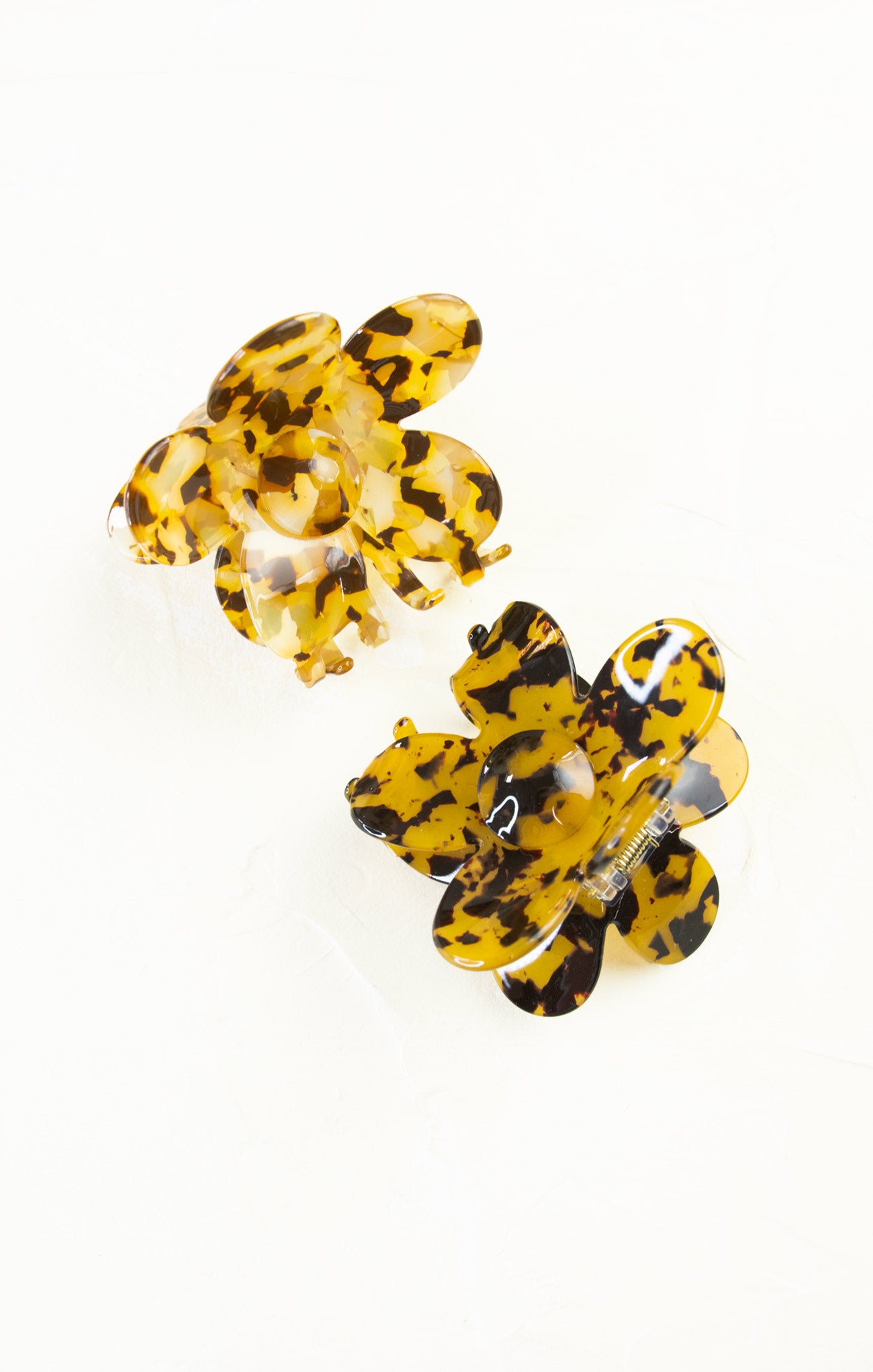 Yellow butterfly-shaped earrings on a white background