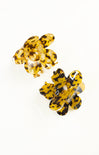 Yellow butterfly-shaped earrings on a white background