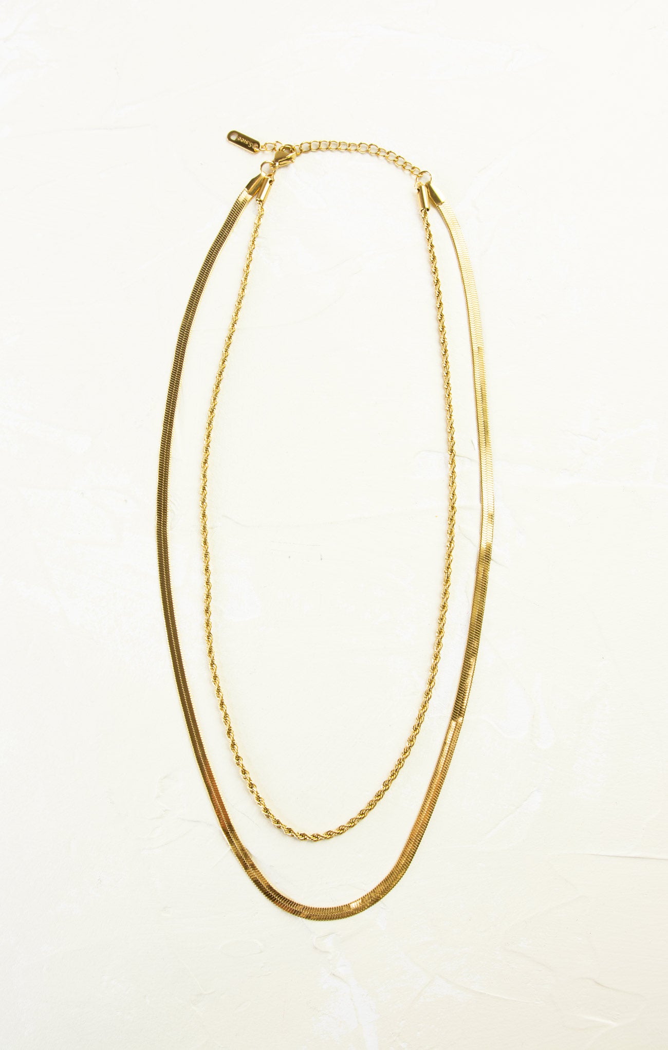Gold necklace on a white background