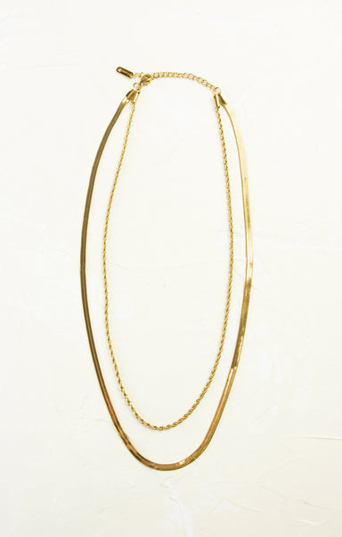 Gold necklace on a white background