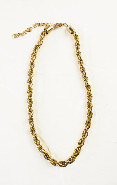 Gold chain necklace on a white background