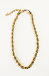 Gold chain necklace on a white background