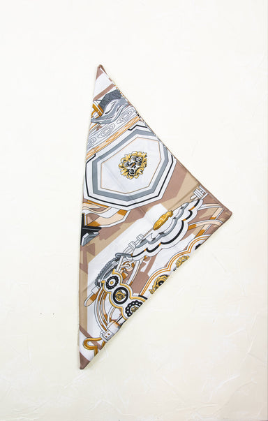 Decorative folded fabric with geometric pattern on a white background