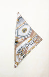 Decorative folded fabric with geometric pattern on a white background
