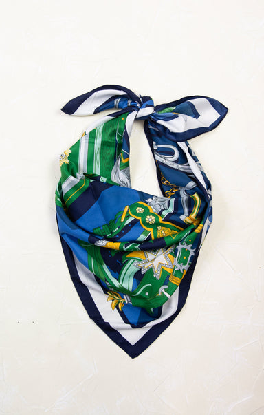 Colorful patterned scarf tied into a knot on a white background
