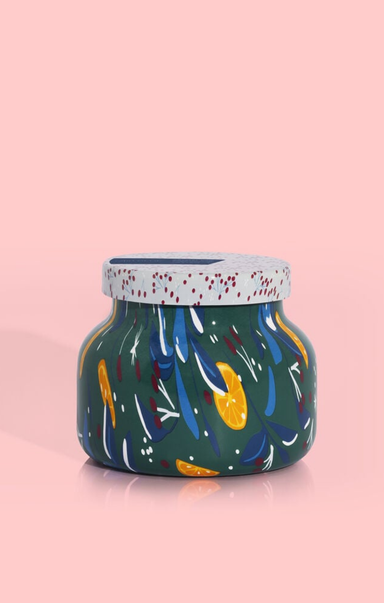 Decorative jar with colorful abstract design on a pink background