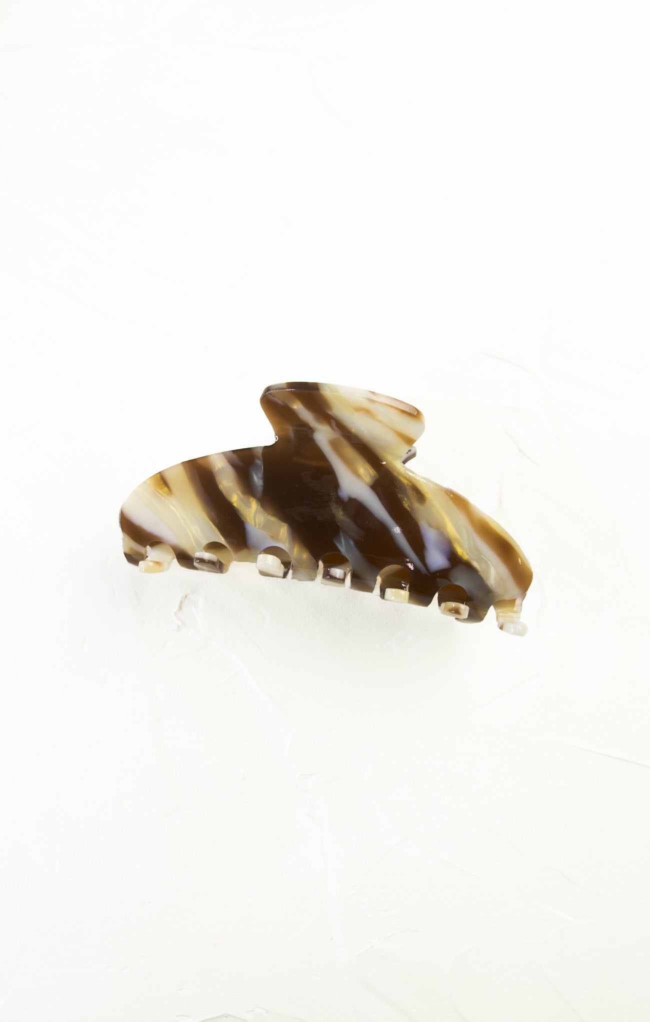 Striped hair clip on a white background