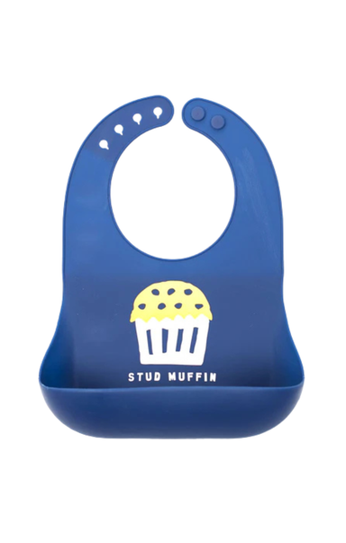 navy bib that says stud muffin on the front on white background