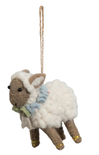 Decorative sheep ornament with a blue scarf on a white background