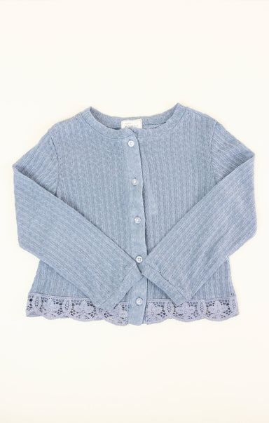 blue knit cardigan on white background
