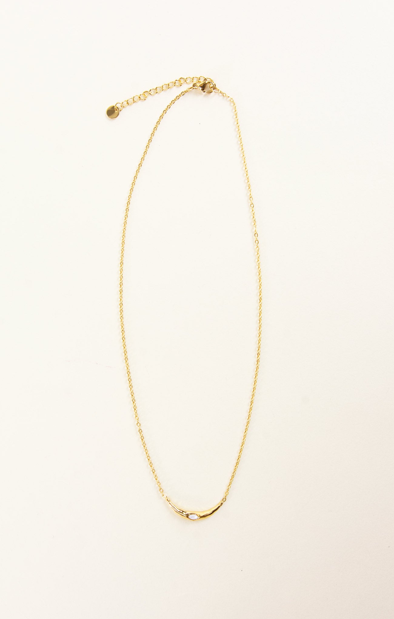 gold necklace on a white background
